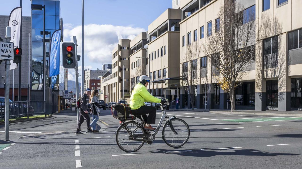 Cyclist on the intersection of Collins and Barrack Street – New bike lanes and parklets proposed. Picture: Caroline Tan