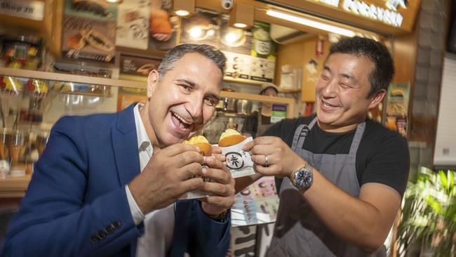 Burwood Mayor John Faker is on a mission to bring people back to Burwood's eat streets, including Burwood Chinatown where Fujimi Dorayaki owner Lance Wei gave the mayor a taste of some of his pancake snacks. Picture: Matthew Vasilescu