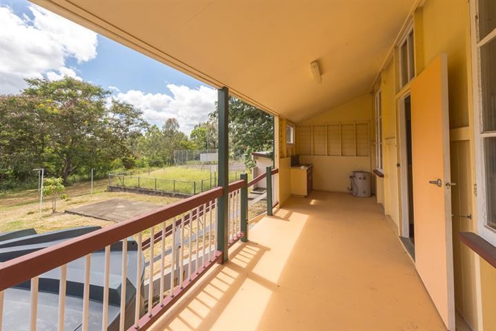 This Raglan Heritage School, built in 1879, and a three-bedroom, high set home are for sale. 