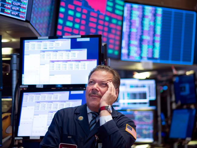 Traders work before the closing bell at the New York Stock Exchange (NYSE) on August 14, 2019 in New York City. - Losses on Wall Street accelerated Wednesday as weak economic data from China and Germany and a key US Treasury benchmark exacerbated global recession fears. Near 1500 GMT, the Dow Jones Industrial Average had lost 535 points, or 2.0 percent, sinking to 25,743.88. The broad-based S&P 500 slid 2.1 percent to 2,866.33, while the tech-rich Nasdaq Composite Index dropped 2.3 percent to 7,831.75. (Photo by Johannes EISELE / AFP)