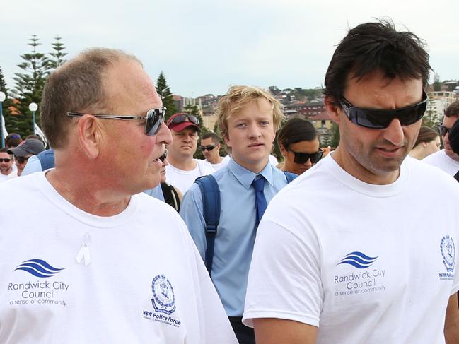 Buzz and Laurie Daley in the White Ribbon Walk from High Cross Park, Randwick to Grant Reserve, Coogee to raise awareness of domestic violence. Picture by DAMIAN SHAW