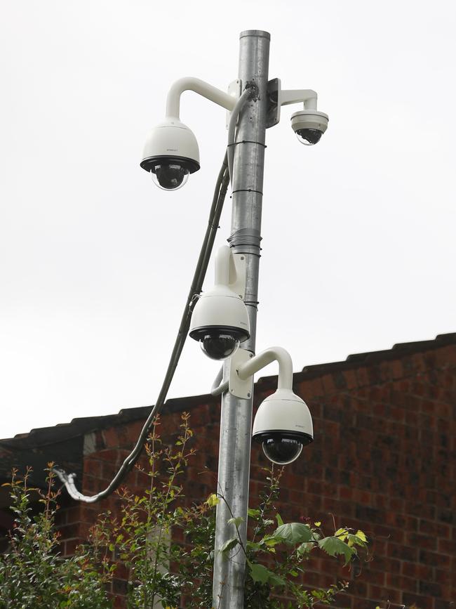 Multiple cameras surround the housing commission property.