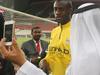 An Emirati fan takes a "selfie" photograph with Manchester City player Yaya Toure during a training session with his team mates at the Sheikh Mohammed Bin Zayed Stadium in Abu Dhabi, on May 14, 2014, prior to their friendly match against UAE's Al-Ain Club. AFP PHOTO/MARWAN NAAMANI