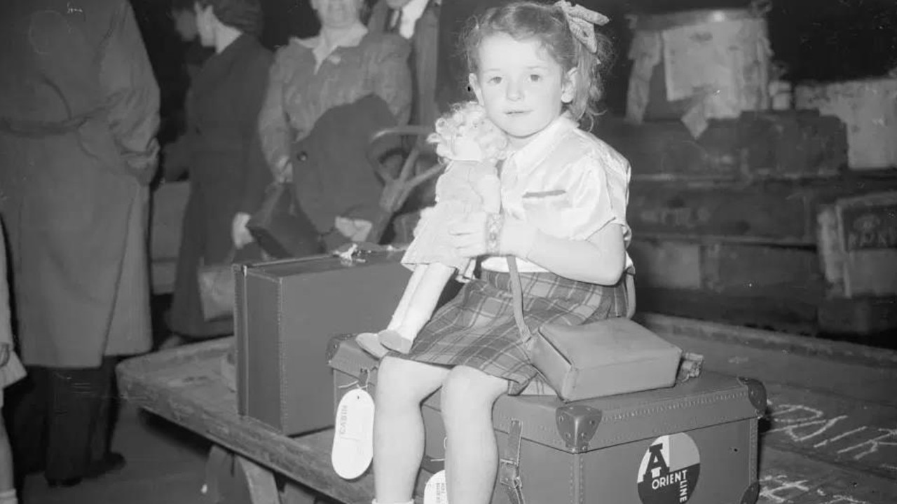 A young girl waiting for her train to Tilbury where she along with 1,100 others would set sail to Australia