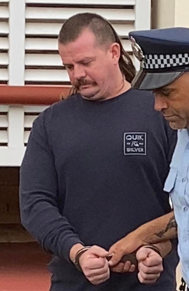 Tory George Andrew Jenkins leaves the Gympie District Court in handcuffs on February 2, 2023.