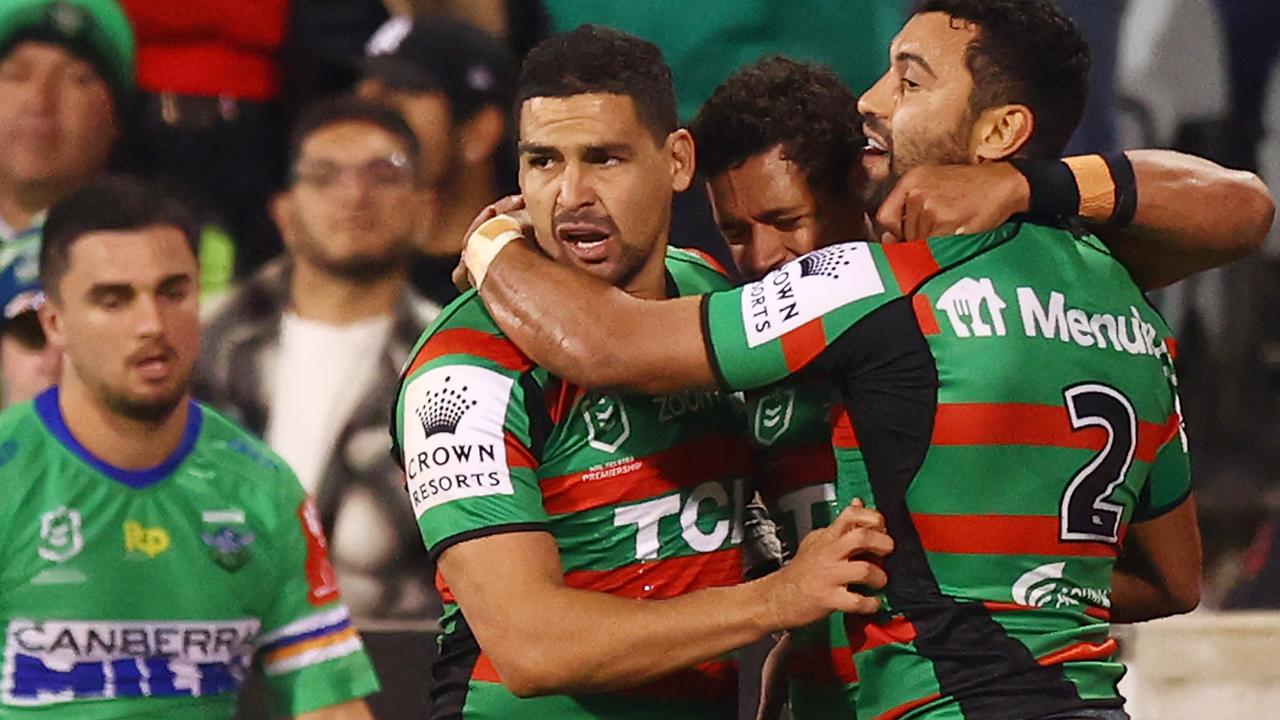 Teammates congratulate Alex Johnston of the Rabbitohs after he scored a try.