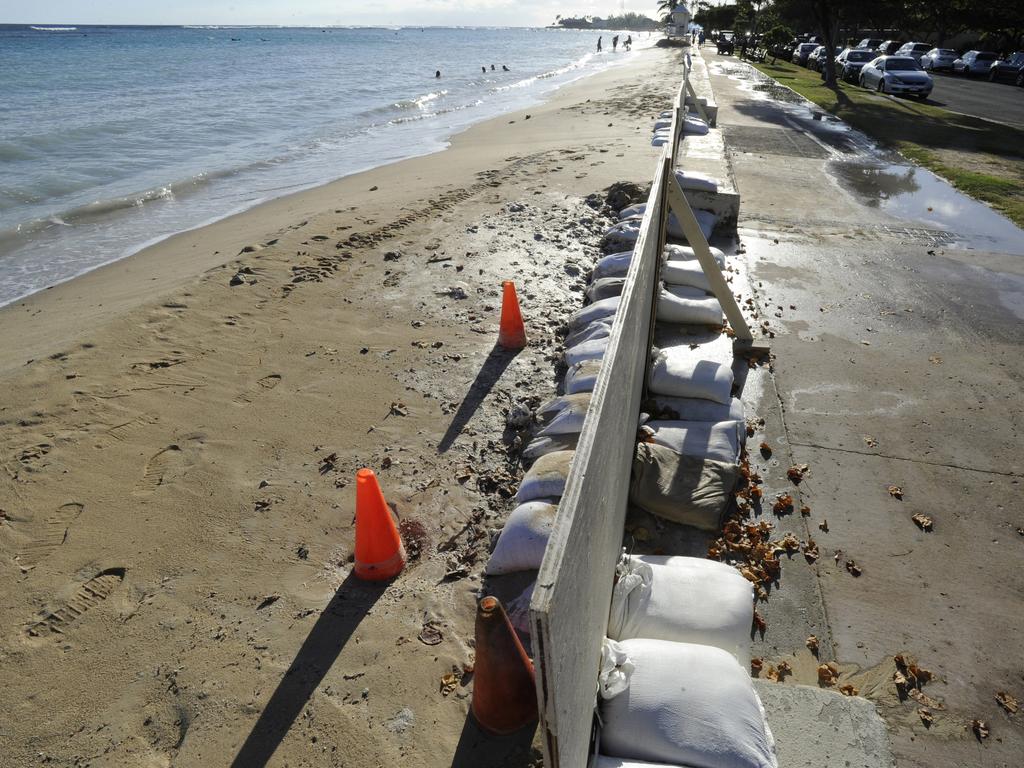 In this June 23, 2017 photo, sand bags line the beach in Honolulu as record high tides hit the islands. Picture: Honolulu Star-Advertiser, Bruce Asato via AP