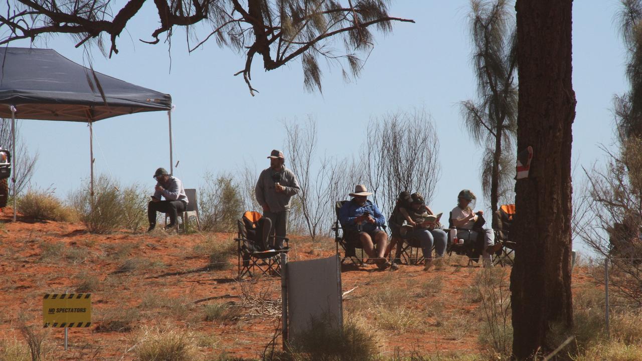 The 2025 Finke Desert Race has begun, with hundreds of punters lining the track south of Alice Springs to catch the action. Picture: Gera Kazakov