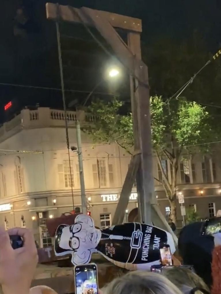 The protesters jeered when a blow-up replica of the Victorian Premier was placed next to the makeshift gallows on the steps of parliament on Monday night. Picture: Twitter
