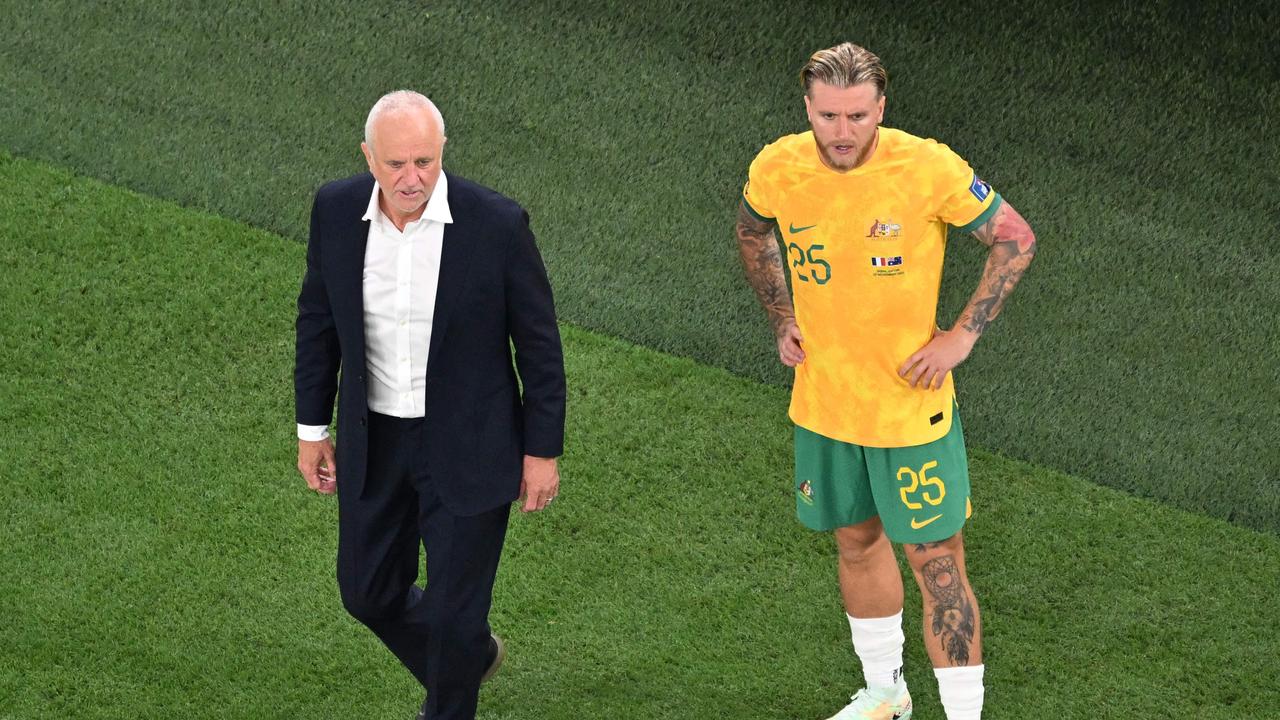 Australia's coach Graham Arnold and Jason Cummings. Photo by Francois-Xavier MARIT / AFP.