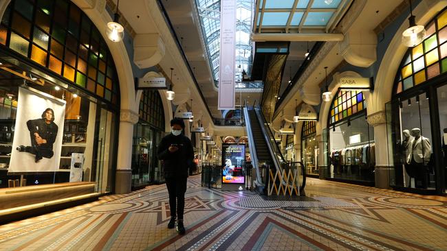 A man walks through a deserted QVB shopping mall normally one of Sydney's busiest malls, as NSW records new Covid cases and deaths. Picture: NCA Newswire /Gaye Gerard