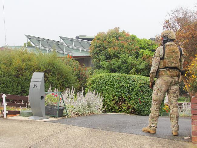 Police during the 16-hour siege. Picture: BRUCE MOUNSTER