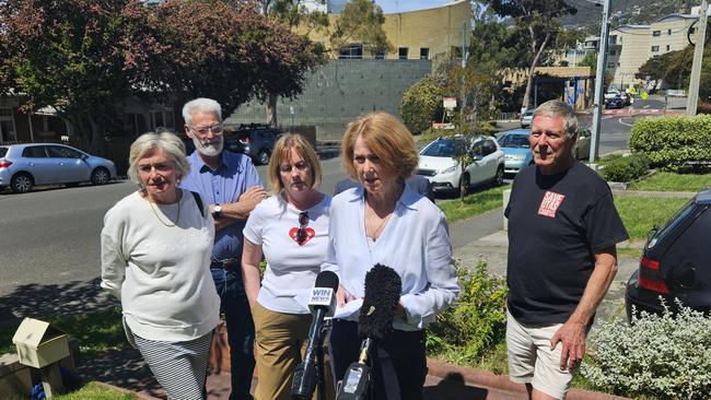 Save UTAS Co-Chair Angela Bird and supporters speak to the media at Sandy Bay on Wednesday, November 6, 2024.