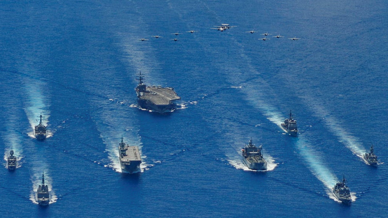 HMA Ships Canberra, Hobart, Stuart, Arunta and Sirius taking part in a trilateral passage in the Philippine Sea with US navy ships, USS Ronald Reagan, Antietam and Mustin and the Japanese Maritime Self-Defense Force’s Akizuki-class destroyer JS Teruzuki. Picture: Australia Department of Defence