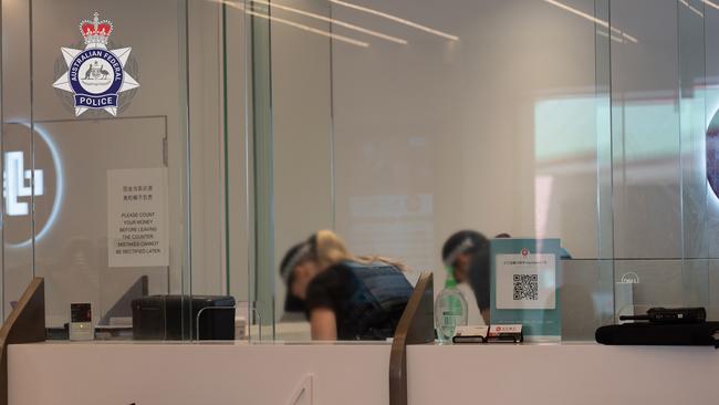 Police execute a search warrant at Changjiang Currency Exchange in the Sydney CBD as part of Operation Avarus-Nightwolf.