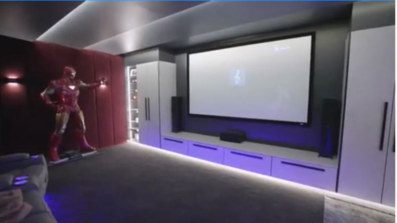 The boys' cinema room featured a life size Iron Man action figure.