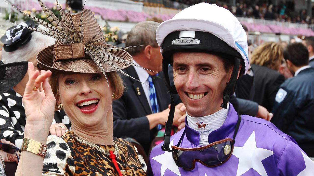 Trainer Gai Waterhouse (L) celebrates with jockey Nash Rawiller after winning race 6 on horse 'Theseo' during Victoria Derby Day at Flemington Racecourse, Melbourne.
