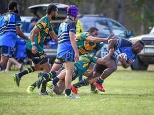 CRASHING THROUGH: Simione Butulovo goes over the line for South Kolan. Picture: Brian Cassidy