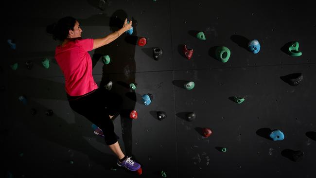 Reporter Mercedes Maguire tries out the climbing wall. Picture: Martin Lange