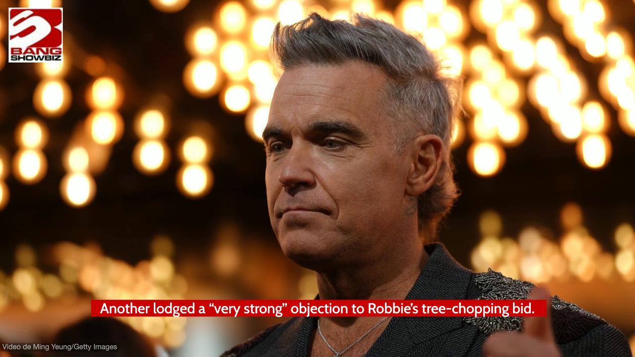 Robbie Williams has been ordered to buy a tulip tree as part of his planning fight victory