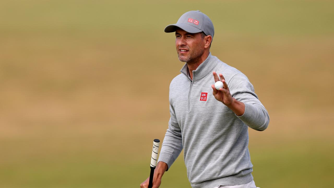 ST ANDREWS, SCOTLAND - JULY 15: Adam Scott of Australia acknowledges the crowd on the 18th green during Day Two of The 150th Open at St Andrews Old Course on July 15, 2022 in St Andrews, Scotland. (Photo by Harry How/Getty Images)