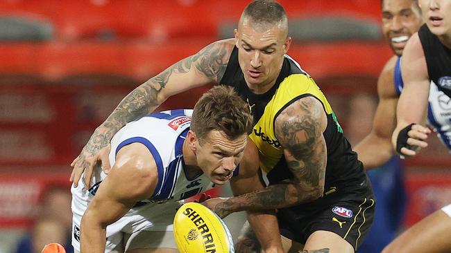 Dustin Martin puts pressure on Shaun Higgins in the first quarter. Picture: Michael Klein