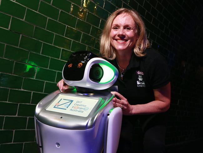 Nicci Rossouw from Exaptec with one of her service and companionship robots. Picture: Sarah Marshall/AAP