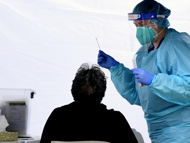 SYDNEY, AUSTRALIA - NCA NewsWire Photos AUGUST, 14, 2020: People are swabbed at a Covid-19 testing site at Rushcutters Bay in Sydney. The nearby the Cruising Yacht Club is closed after a member tested positive for Covid 19. Picture: NCA NewsWire/Joel Carrett