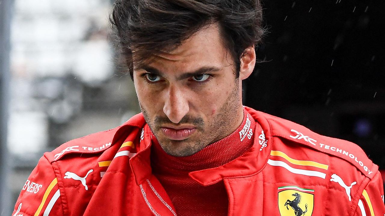 Ferrari's Spanish driver Carlos Sainz Jr. walks during the second practice session ahead of the Formula One Japanese Grand Prix race at the Suzuka circuit in Suzuka, Mie prefecture on April 5, 2024. (Photo by Toshifumi KITAMURA / AFP)