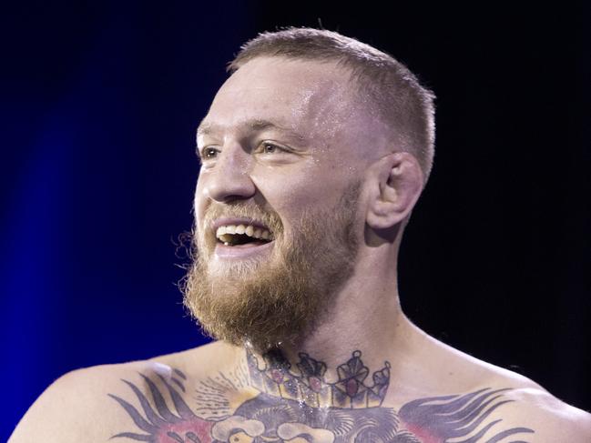 FILE - In this Wednesday, March 2, 2016 file photo, UFC featherweight champion Conor McGregor smiles during open workouts for UFC 196 at MGM Grand in Las Vegas. McGregor says his dispute with UFC became a 