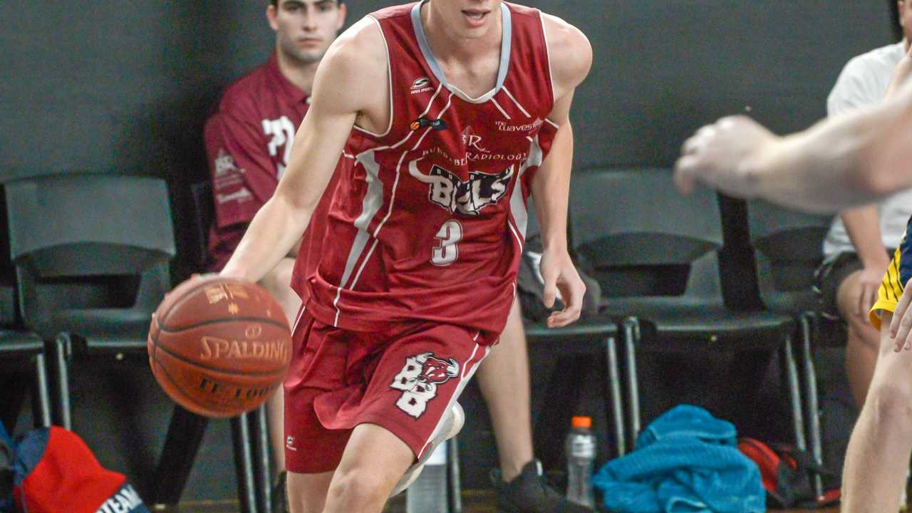 ON THE RUN: Bundaberg Bulls player Tyler Davis moves towards the basket. Picture: Brian Cassidy