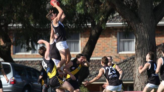 Farmer soars high above the pack against Mitcham. Picture: Garry Sparke/Sporting Images