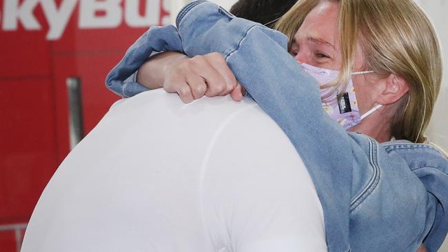 Jacki Clark and boyfriend Dan share a hug after 6 weeks apart.. Picture: David Crosling