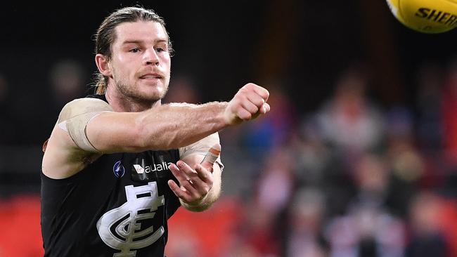 Bryce Gibbs fires off a handball in the win over Gold Coast.