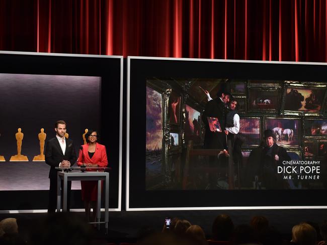 Oops ... Actor Chris Pine and Academy President Cheryl Boone Isaacs announce Dick Pope as a nominee for Best Cinematography. Picture: Getty.