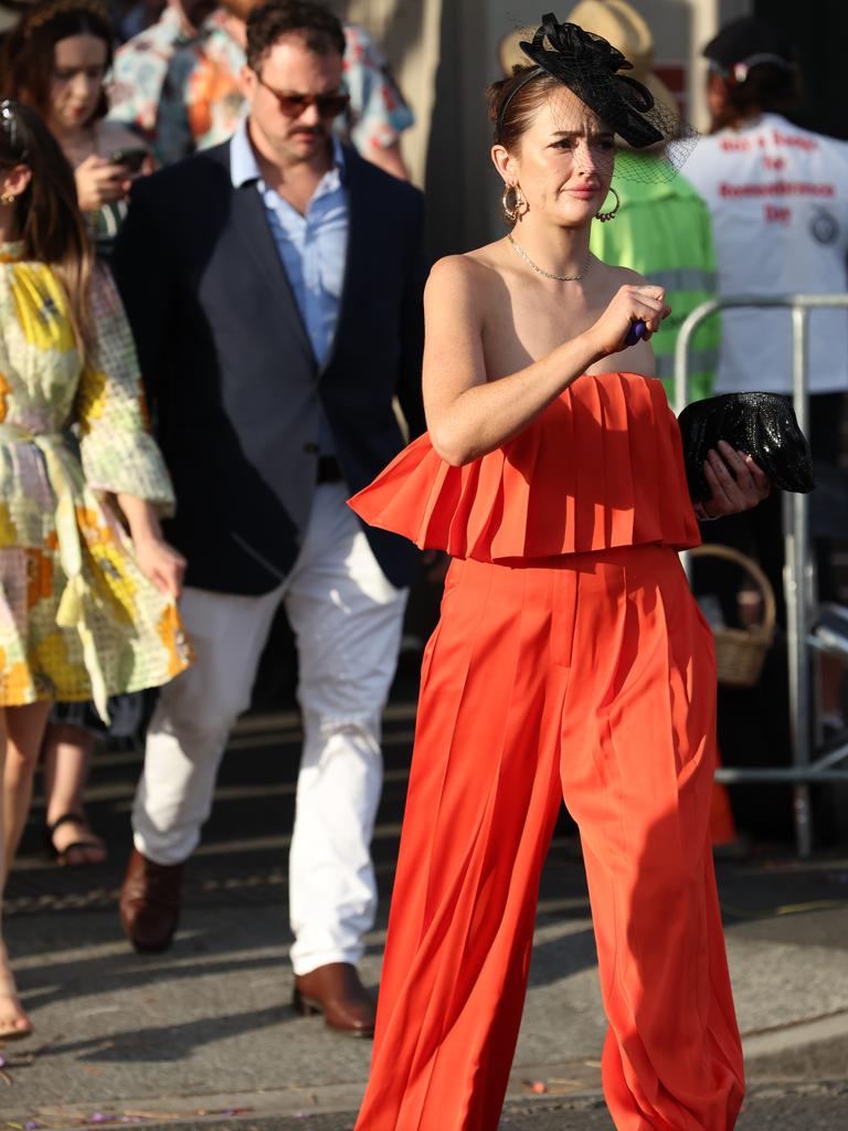 Punters leave Eagle Farm racecourse on Melbourne Cup Day.