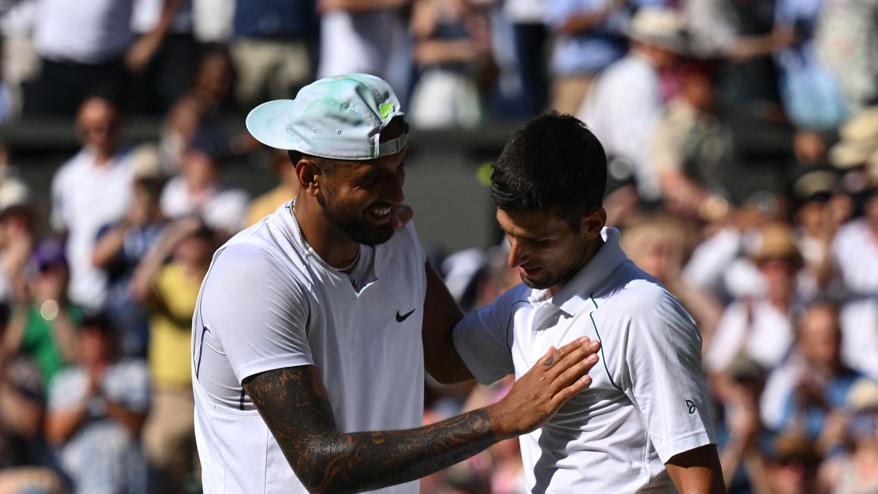 Nick Kyrgios (L), congratulating Novak Djokovic after his Wimbledon final victory this year, has become close to the controversial star. Picture: AFP