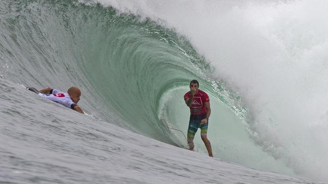 MARCH 13, 2013: Kelly Slater about to drop in on Joel Parkinson in the final of the Quiksilver Pro. Pic credit: ASP/CAREY