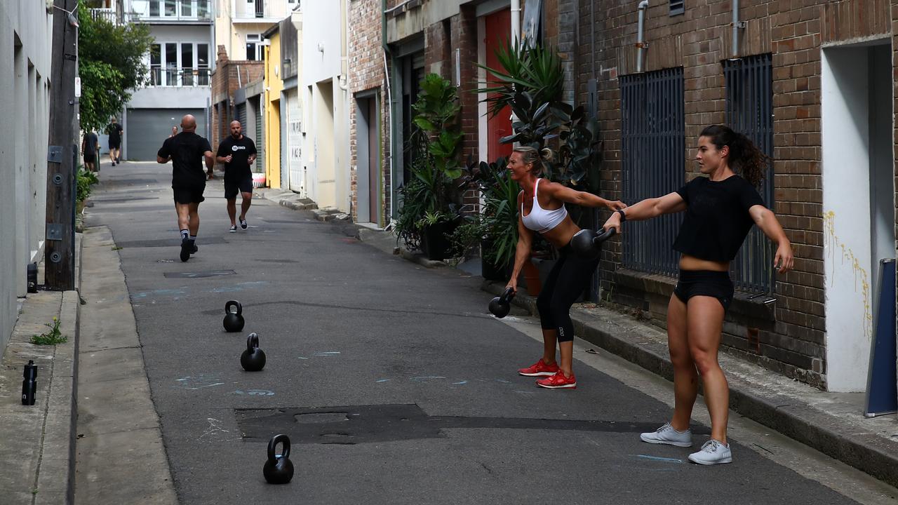 Instructors from Riley Street Gym in Sydney made good use of the remaining hours before the gym is forced to close. Picture: Matrix