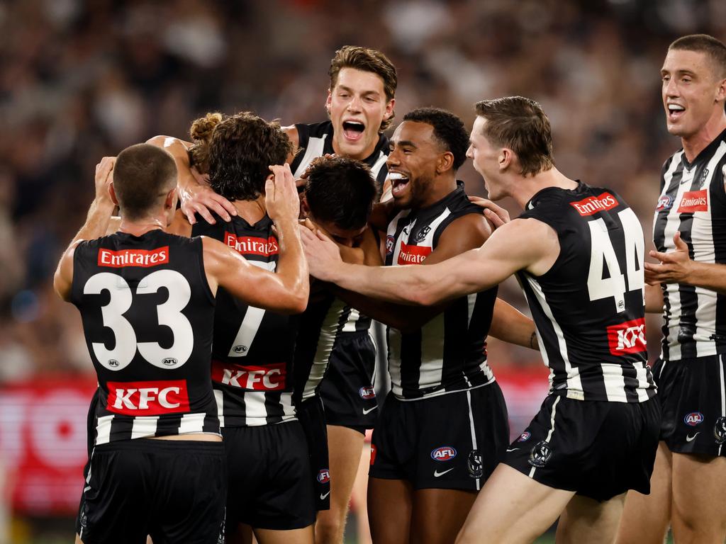 Brayden Maynard is mobbed by Magpies teammates. Picture: Dylan Burns/AFL Photos via Getty Images.