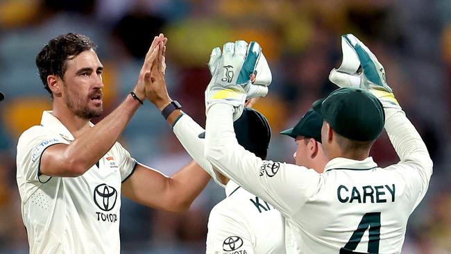 Mitchell Starc celebrates with teammates after dismissing West Indies batter Kavem Hodge late on day one of the second Test at the Gabba. Picture: AFP