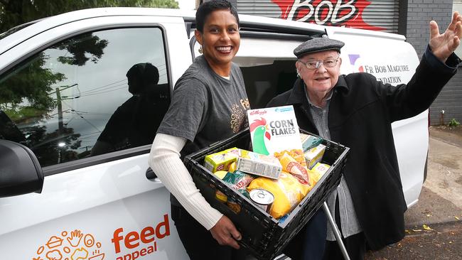 Feed Appeal chief executive Katherine Gokavi-Whaley and Fr Bob Maguire with the new van. Picture: Ian Currie