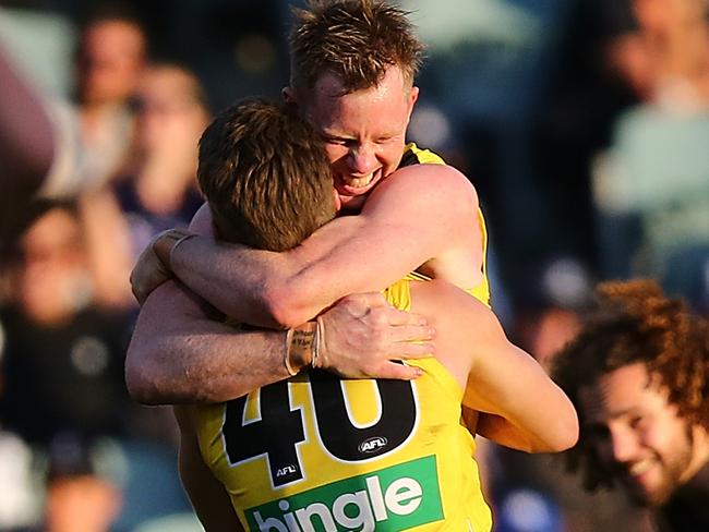 PERTH, AUSTRALIA - AUGUST 20:  Dan Butler and Jack Riewoldt of the Tigers celebrate winning the round 22 AFL match between the Fremantle Dockers and the Richmond Tigers at Domain Stadium on August 20, 2017 in Perth, Australia.  (Photo by Paul Kane/Getty Images)