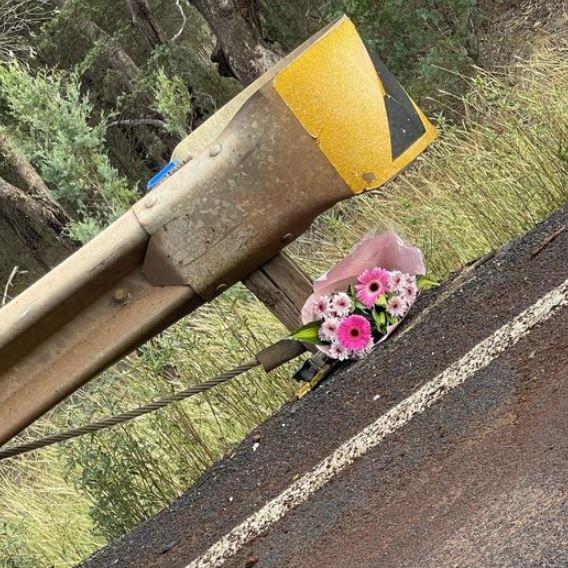 Dubbo highway patrol officers who attended the crash at Ballimore returned to the scene the following morning to lay flowers. Picture: NSW Police