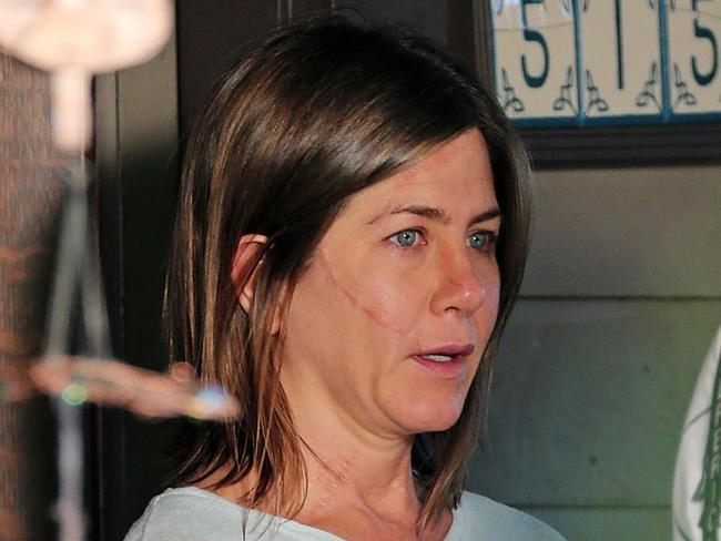 Jennifer Aniston shows off her prosthetic scars on set of Cake in Eagle Rock, CA.