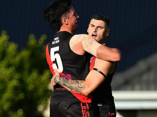 Paul Ahern of Pascoe Vale is congratulated by team mates after kicking a goal during the round two Strathmore Community Bank Premier Division Seniors match between Pascoe Vale and Strathmore at Raeburn Reserve, on April 20, 2024, in Melbourne, Australia. (Photo by Josh Chadwick)