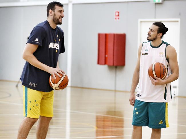 Chris Goulding hams it up with injured Boomers centre Andrew Bogut at training. Picture: Michael Klein