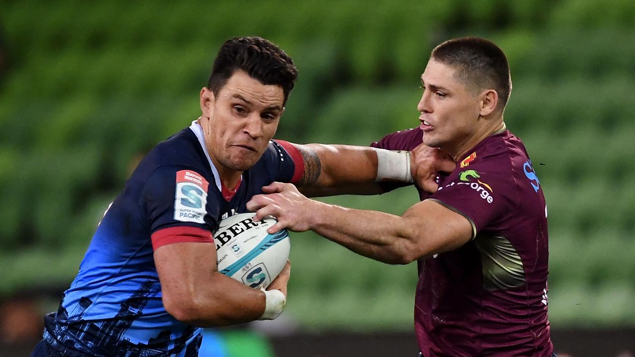 The Rebels’ Matt To'omua (left) tries to fend off the Reds’ James O'Connor during Queensland’s win at AAMI Park. Picture: William WEST / AFP