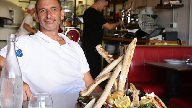 Alex Simcic with a selection of antipasto and grissini.