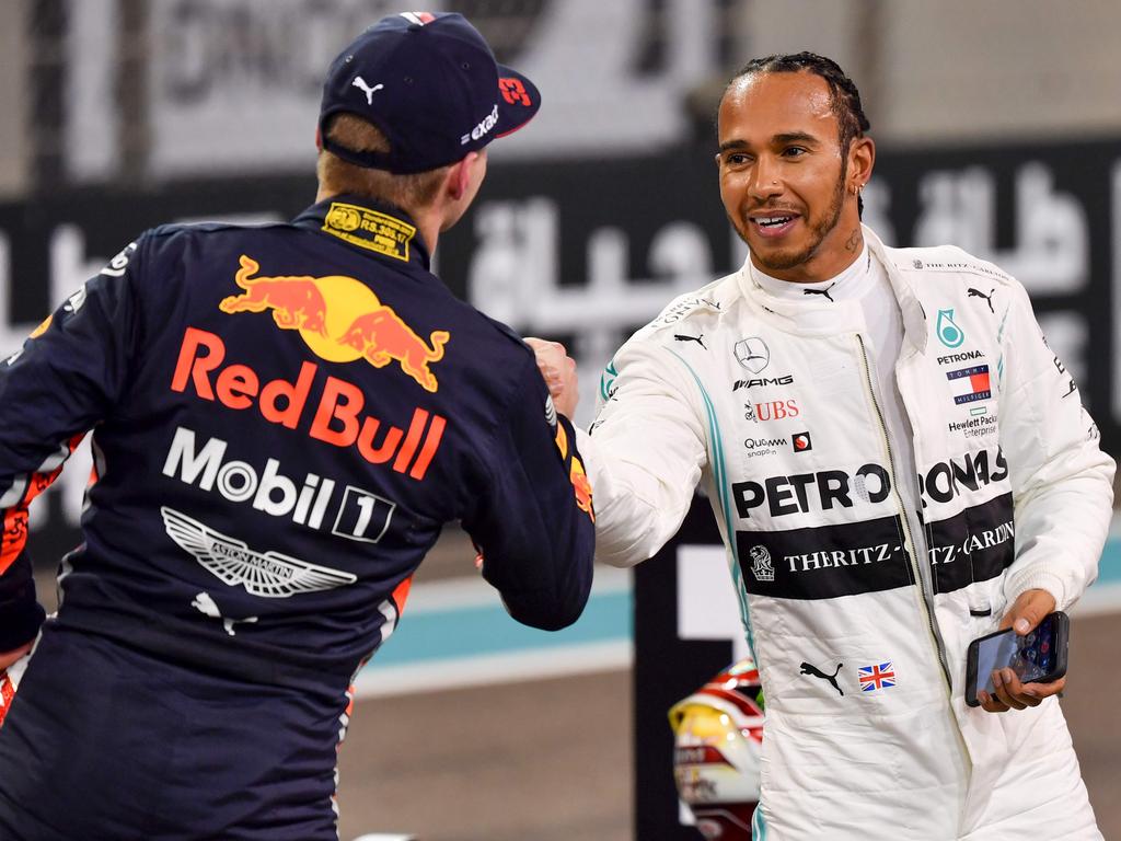 Max Verstappen shakes hands with Lewis Hamilton. (Photo by ANDREJ ISAKOVIC / AFP)